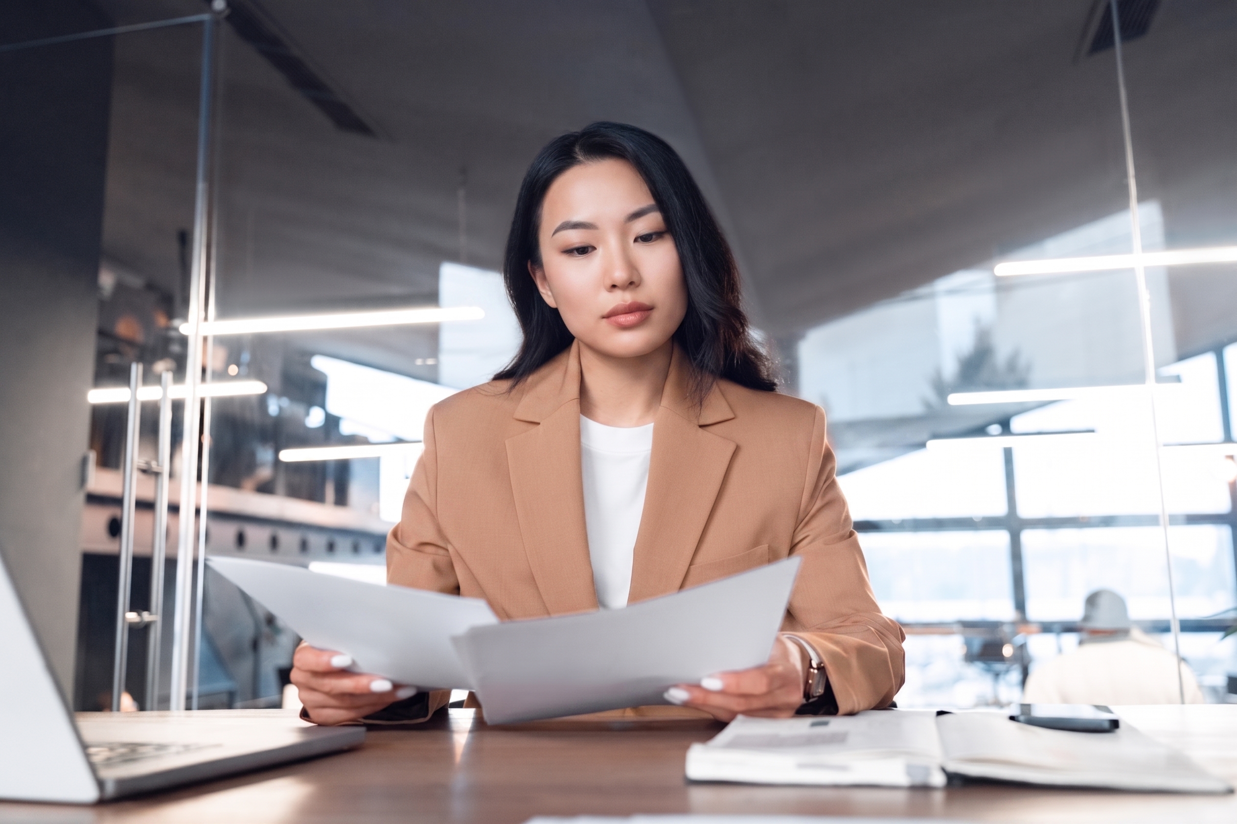 A woman carefully examining a document