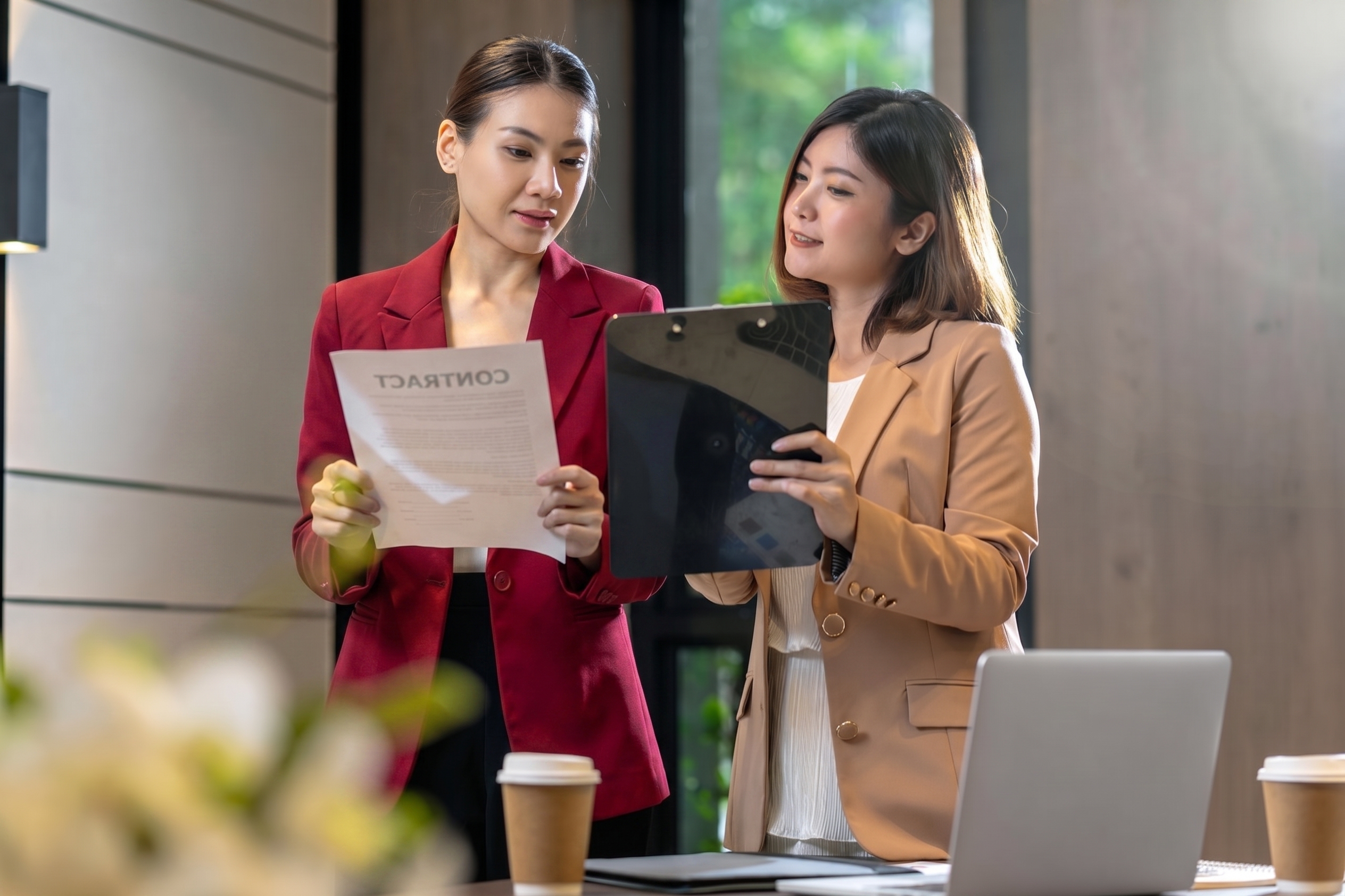 Two people reviewing a document together